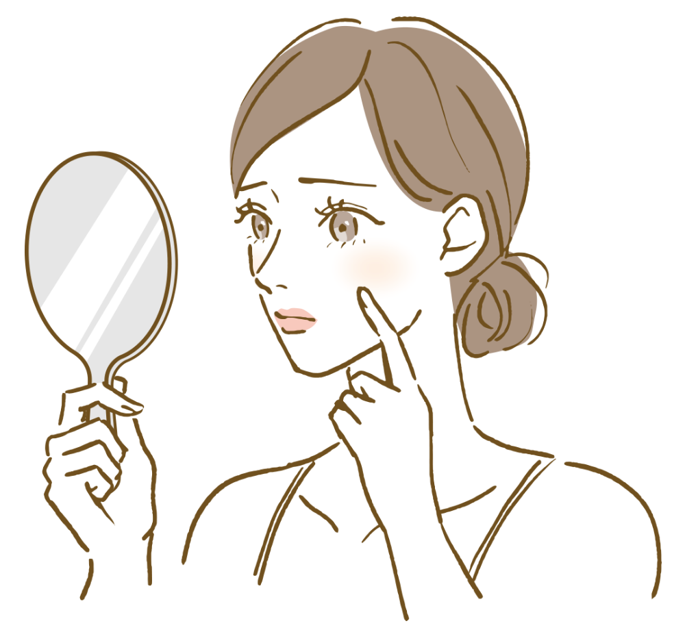 はだの悩みで鏡をみる女性